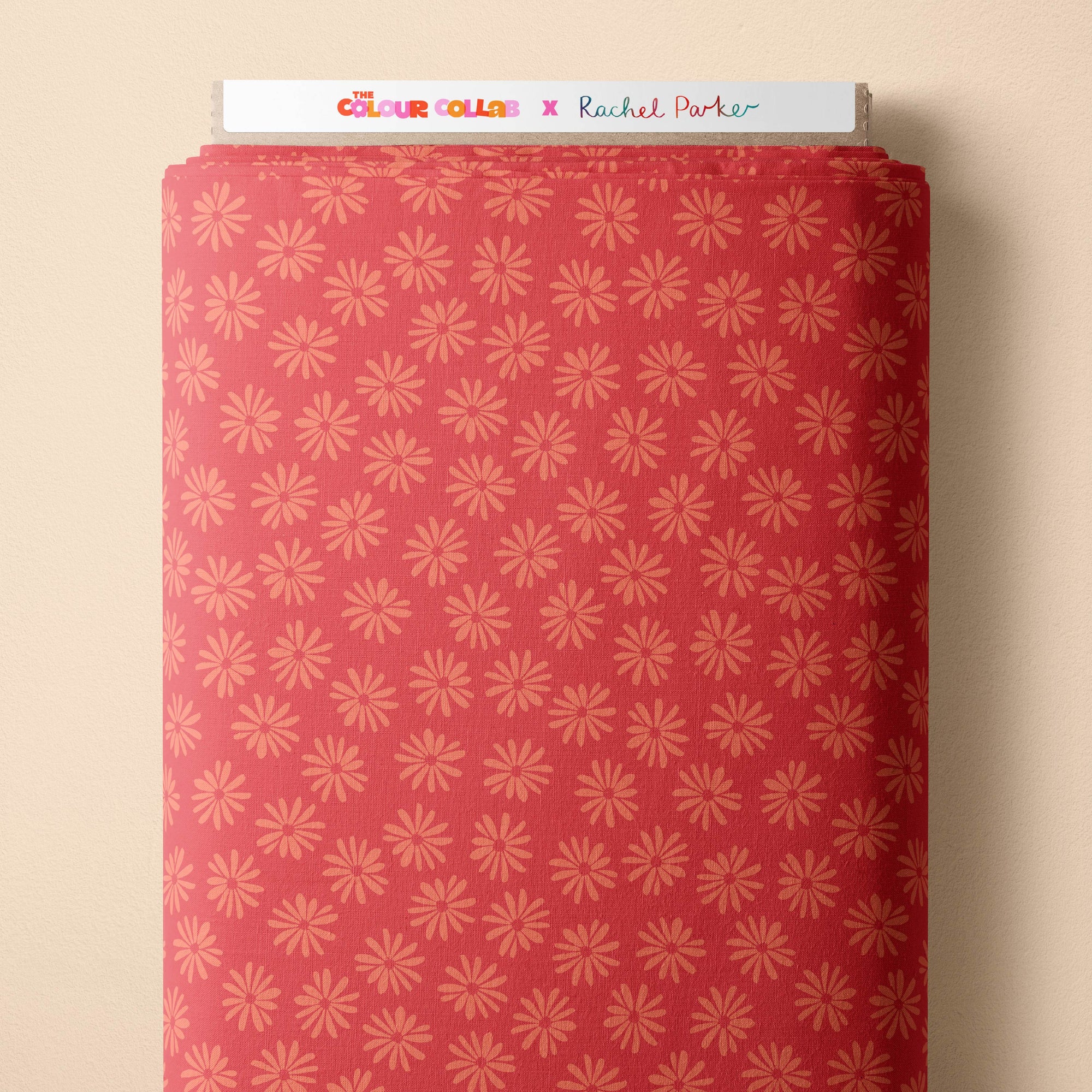 Halo Daisy (Tangerine) fabric by Rachel Parker mock up on fabric bolt