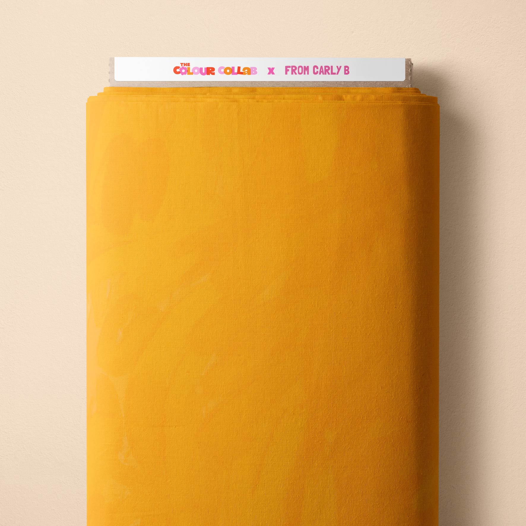 Plain Colour (Marigold) fabric by Carly B mock up on fabric bolt