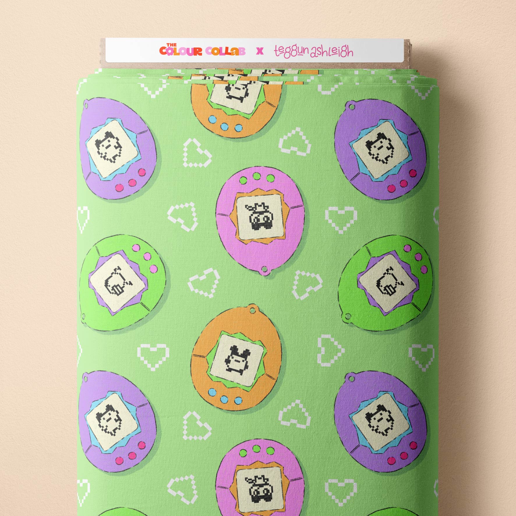 Tamagotchi (Green) fabric by The Colour Collab mock up on fabric bolt