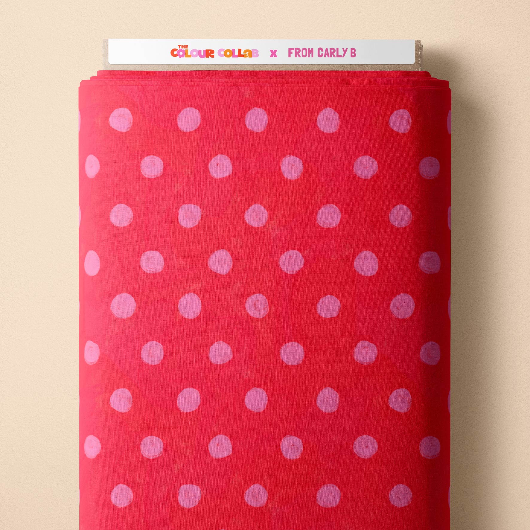 Teeny Tiny Polka Dots (Bubblegum & Watermelon) fabric by Carly B mock up on fabric bolt