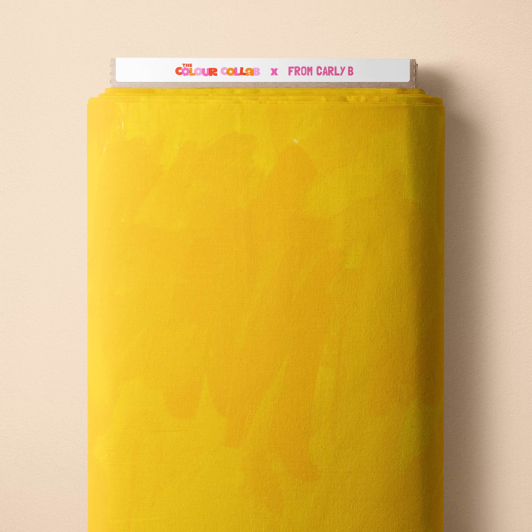 Plain Colour (The Happiest Yellow) fabric by Carly B mock up on fabric bolt