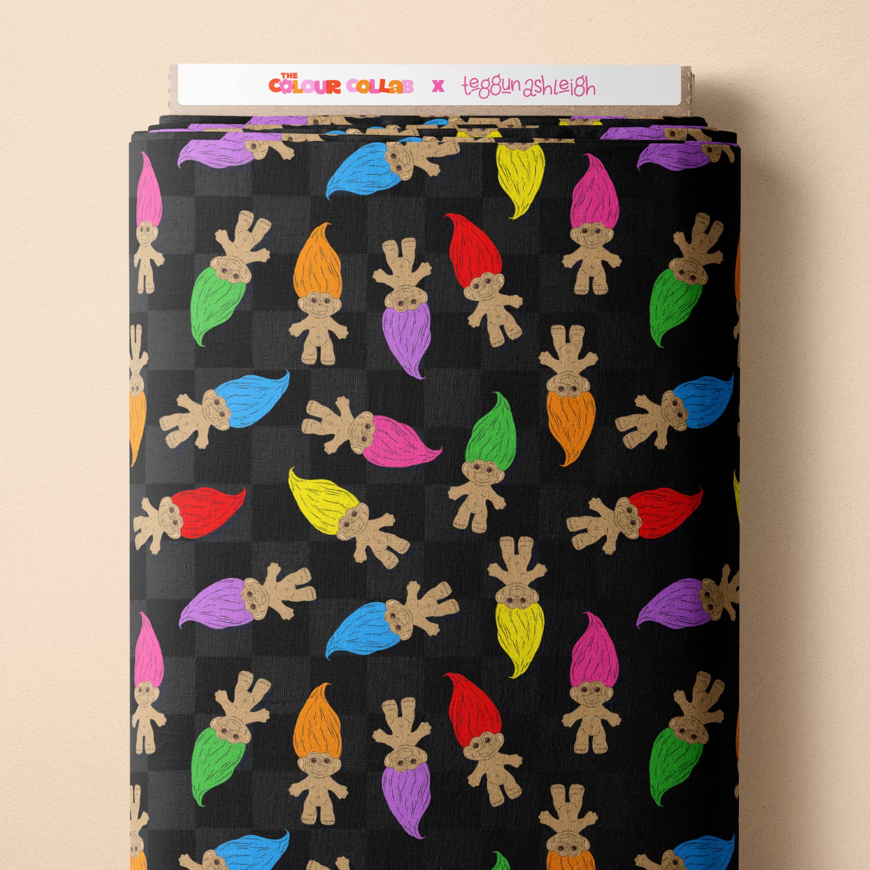 Trolls (Black) fabric by The Colour Collab mock up on fabric bolt