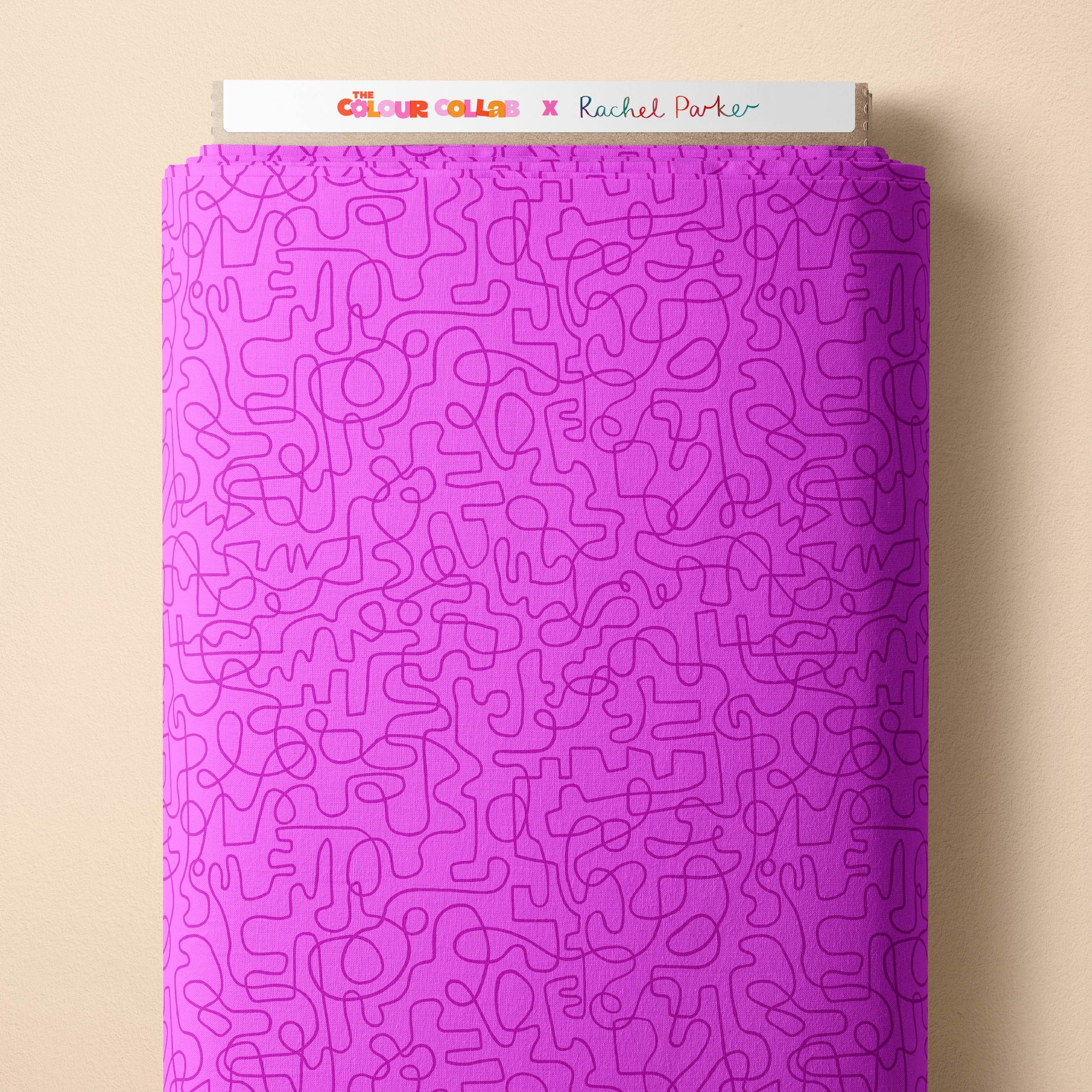 Wiggles (Purple Pop/Magenta) fabric by Rachel Parker mock up on fabric bolt