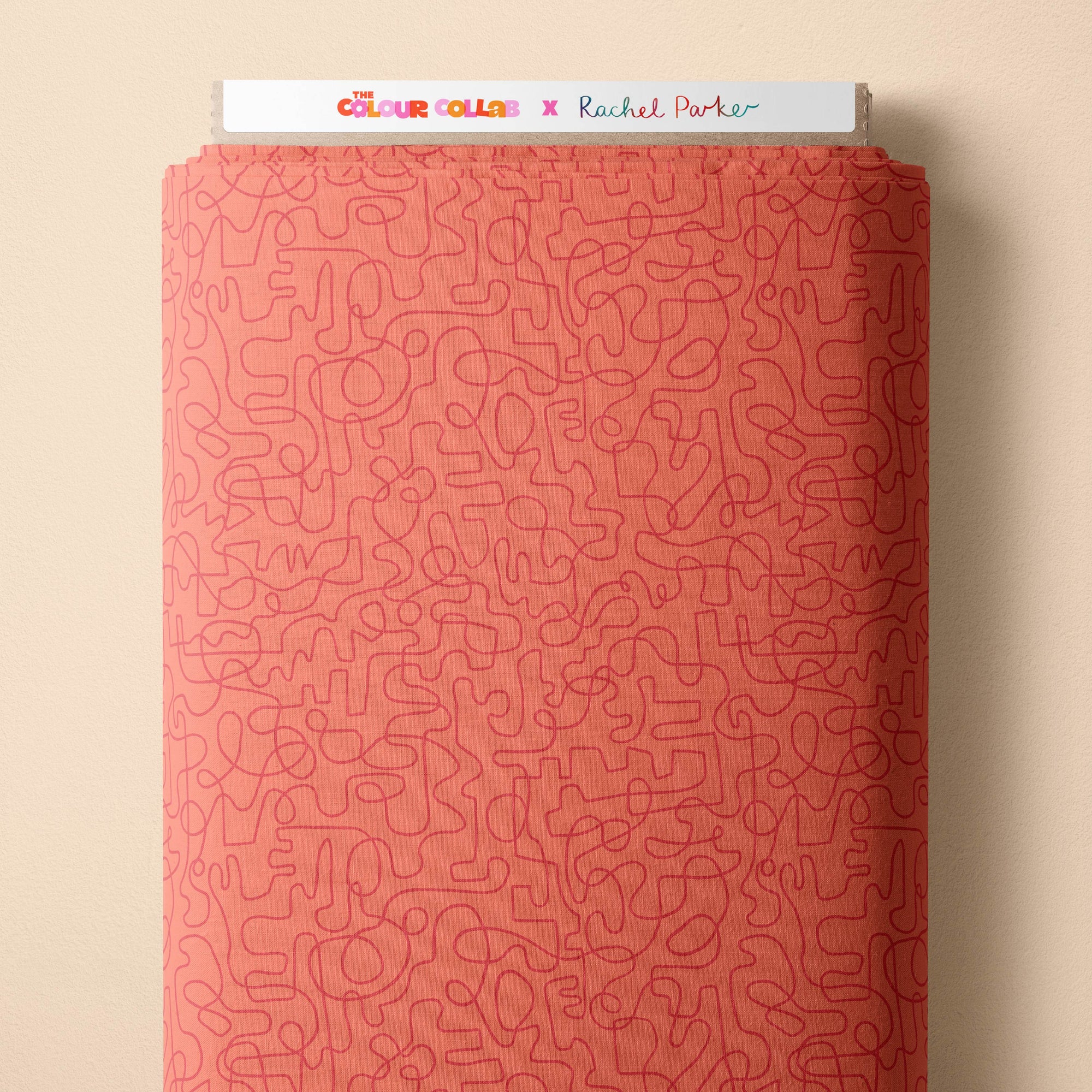 Wiggles (Tangerine/Very Berry) fabric by Rachel Parker mock up on fabric bolt