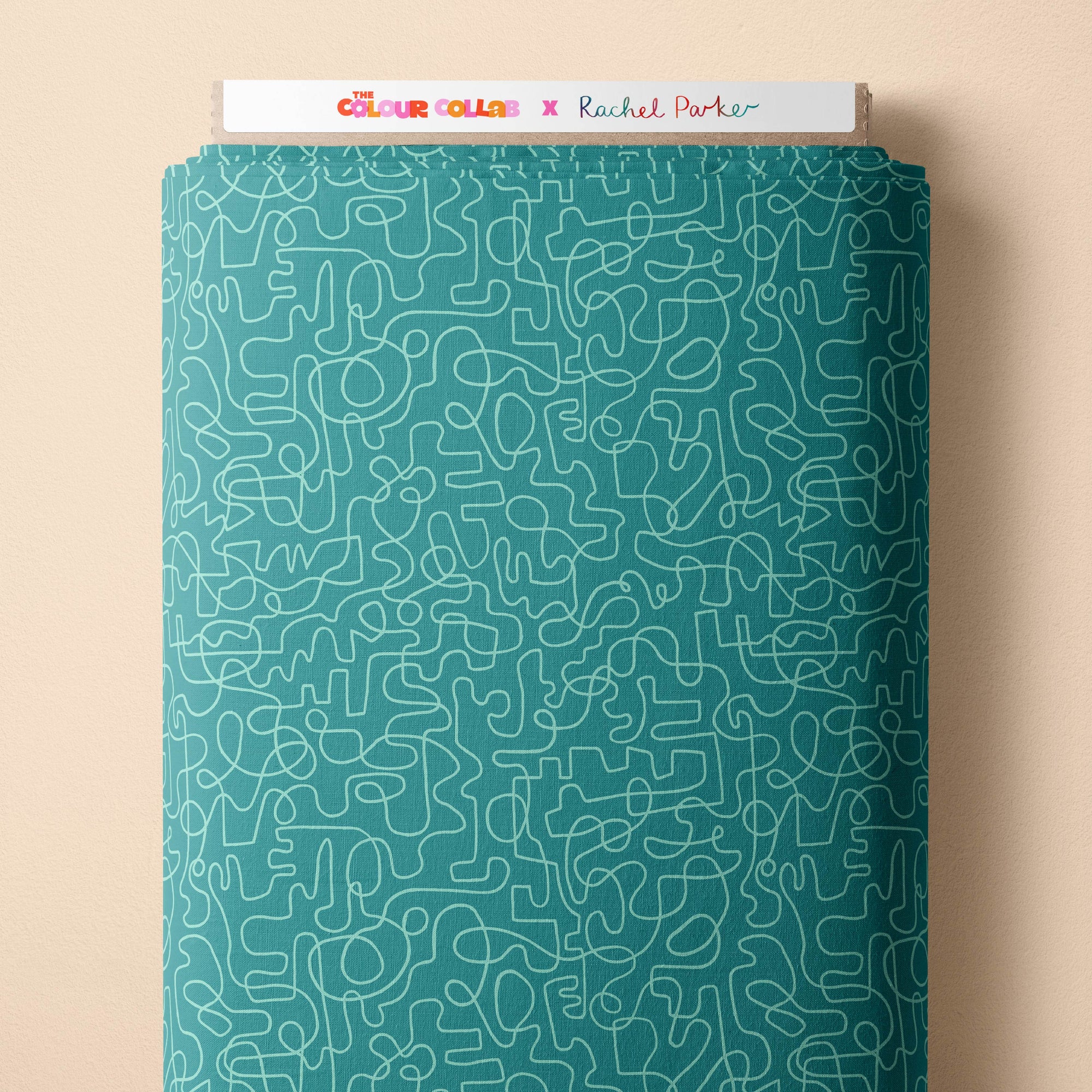 Wiggles (Dusty Teal/Seafoam) fabric by Rachel Parker mock up on fabric bolt