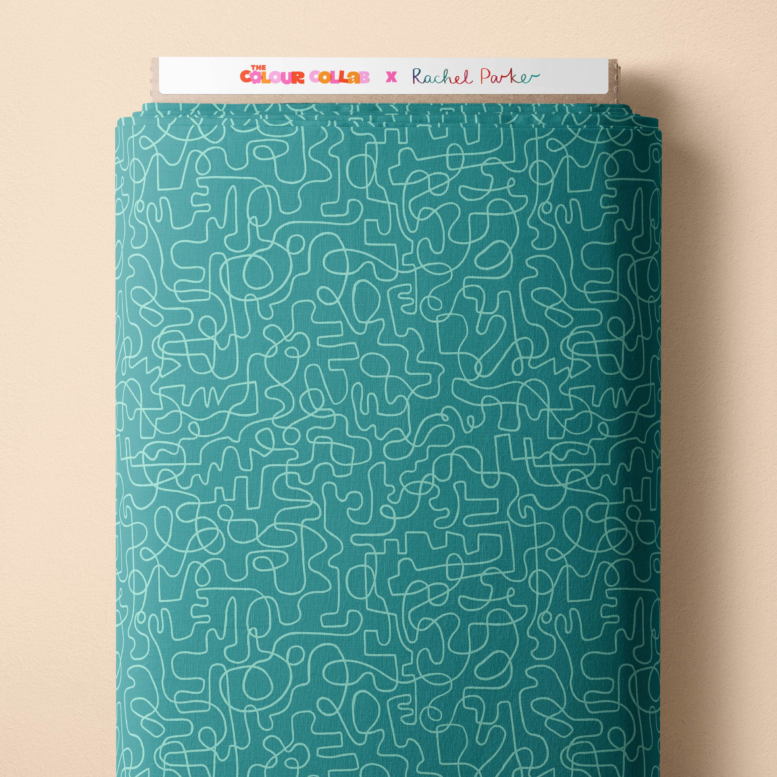 Wiggles (Dusty Teal/Seafoam) fabric by Rachel Parker mock up on fabric bolt